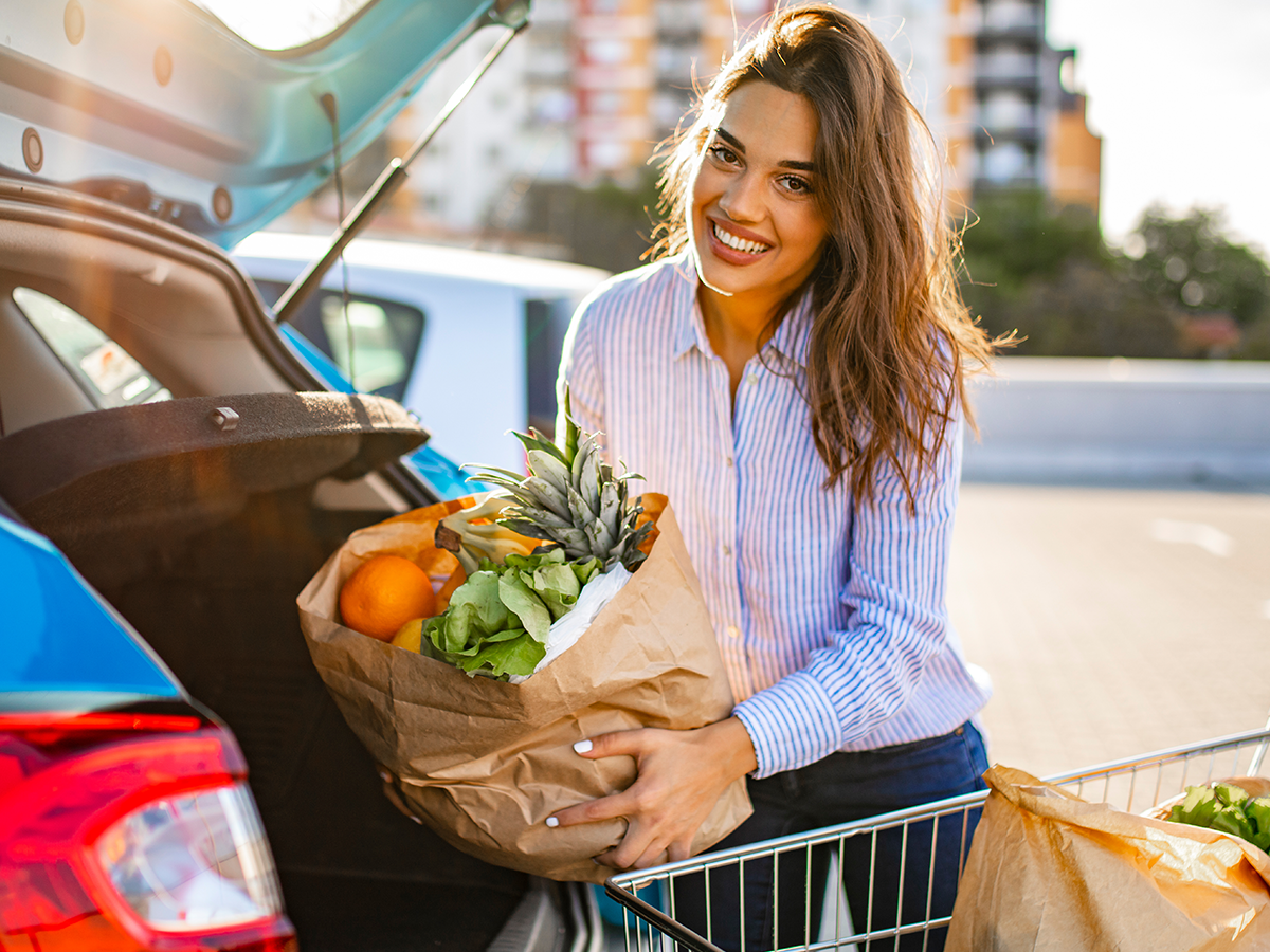 Woman holding a bag of groceries